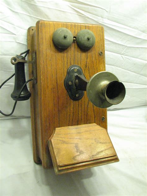 metal telephone in a wooden box with two lines|wall phones made of oak.